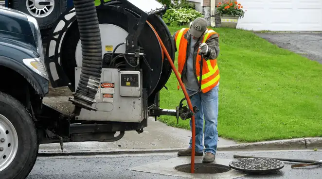 Technician using specialized drainage equipment for sewer line cleaning and foundation protection in Salt Lake City, UT