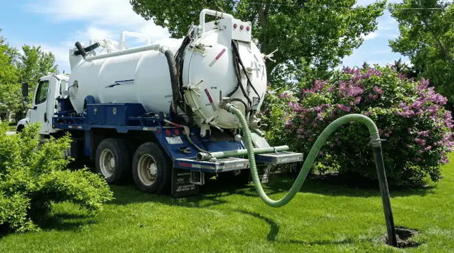 Professional vacuum truck performing residential drainage and septic maintenance in Salt Lake City, UT